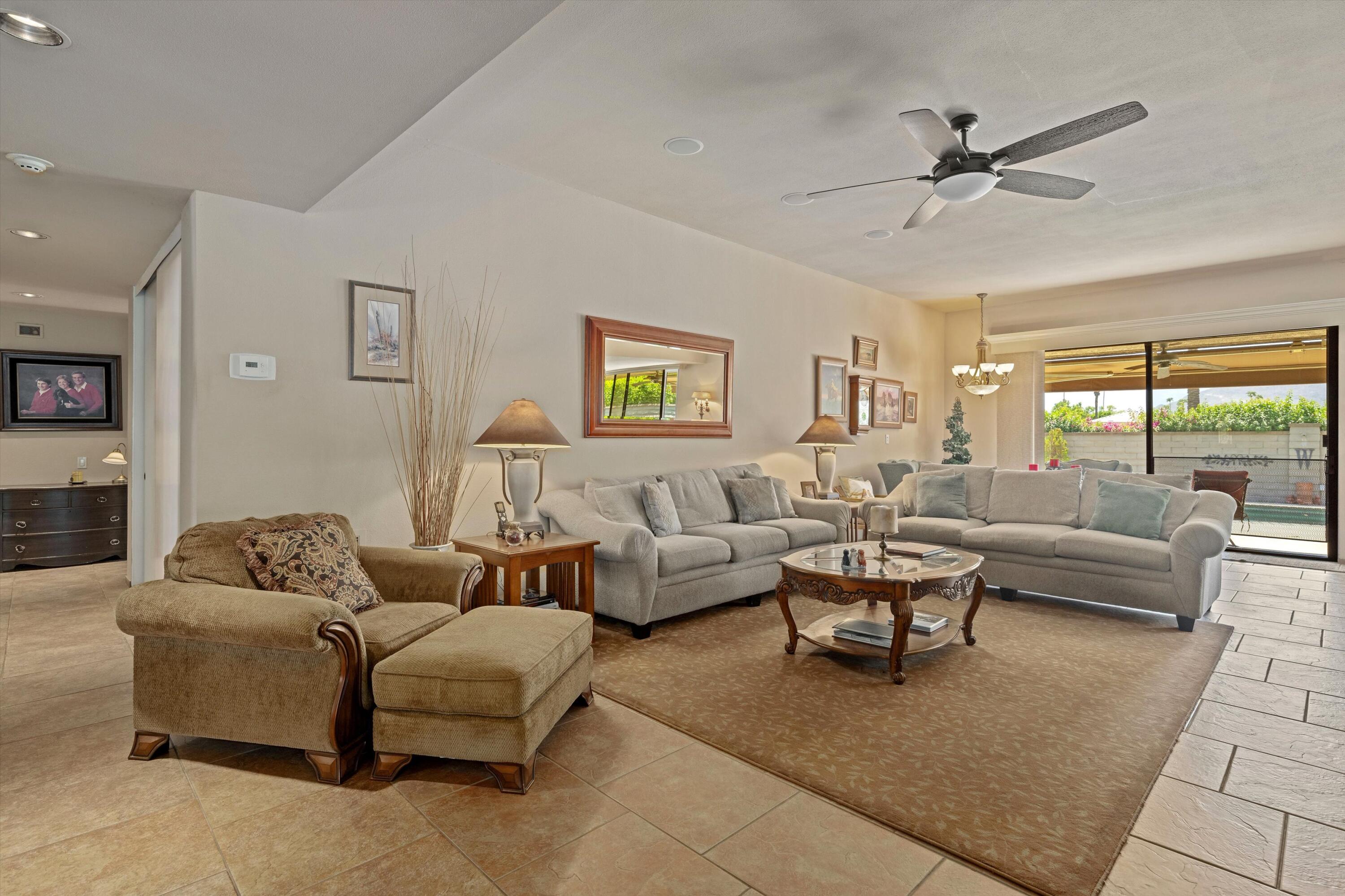 48 Cornell Drive Rancho Mirage, CA 92270 - Photo 8 of 39 a living room with furniture and a large window