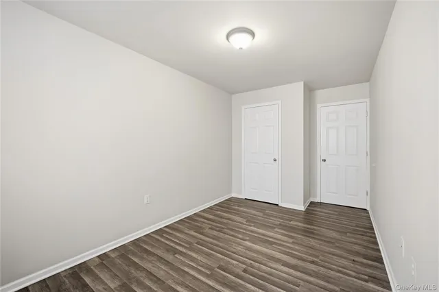 a view of room with wooden floor
