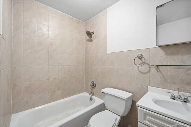 a bathroom with a toilet and a sink