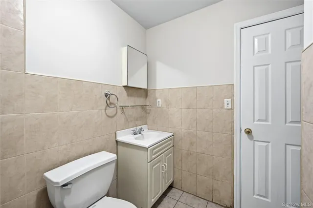 a bathroom with a toilet sink and vanity