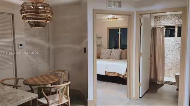 a view of a bedroom with bed and furniture