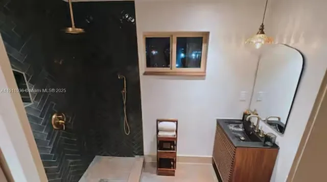 a bathroom with a sink and mirror