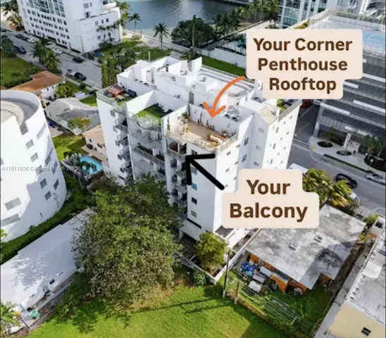 a view of a house with a yard and potted plants