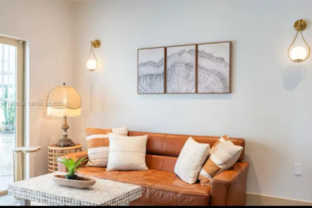 a living room with furniture and a painting