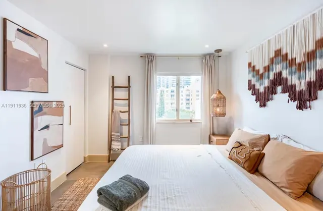 a bedroom with a bed and a couch