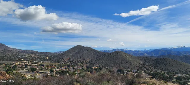 a view of a city with mountains in the background