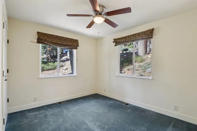 a view of an empty room with a cabinet
