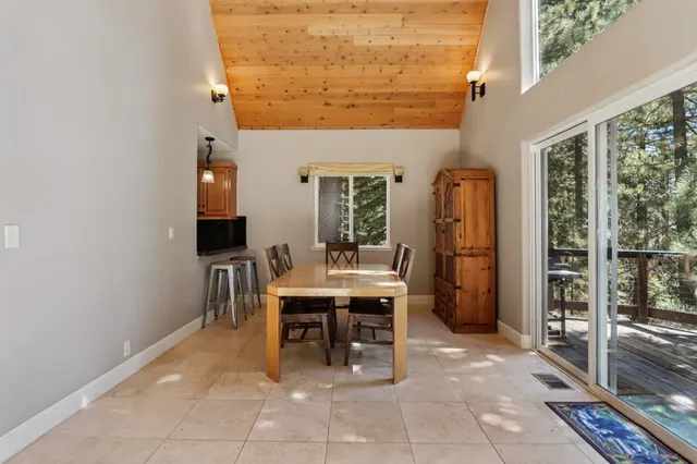 a dining room with a table and chairs