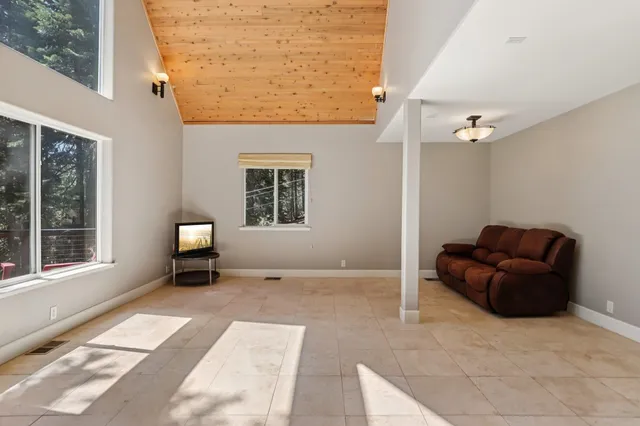 a view of living room with furniture and a window