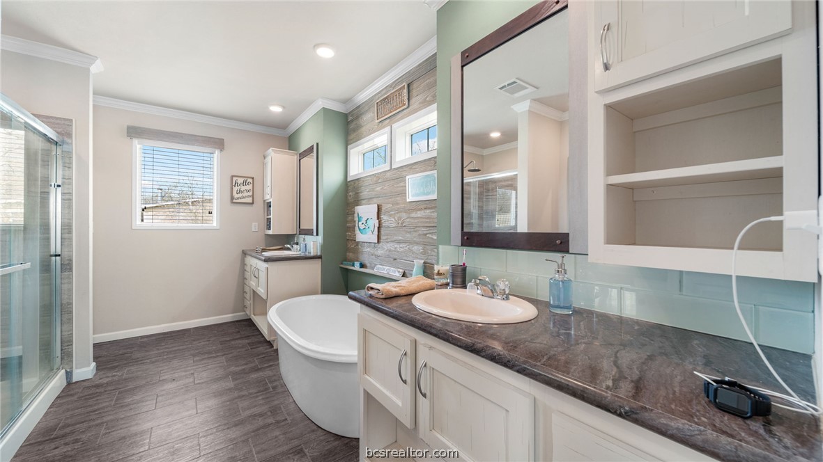 115 Cedar Lane Somerville, TX 77879 - Photo 11 of 50 a bath room with a sink and a large mirror