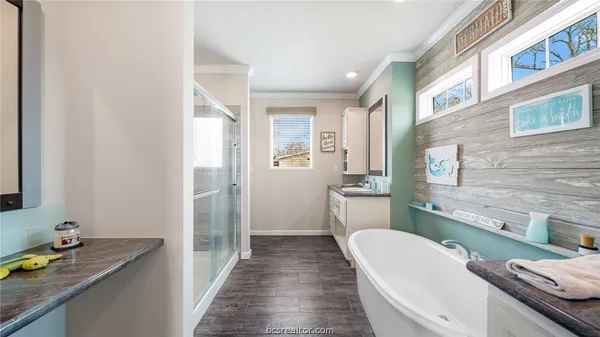 a bedroom with a bed and ceiling fan