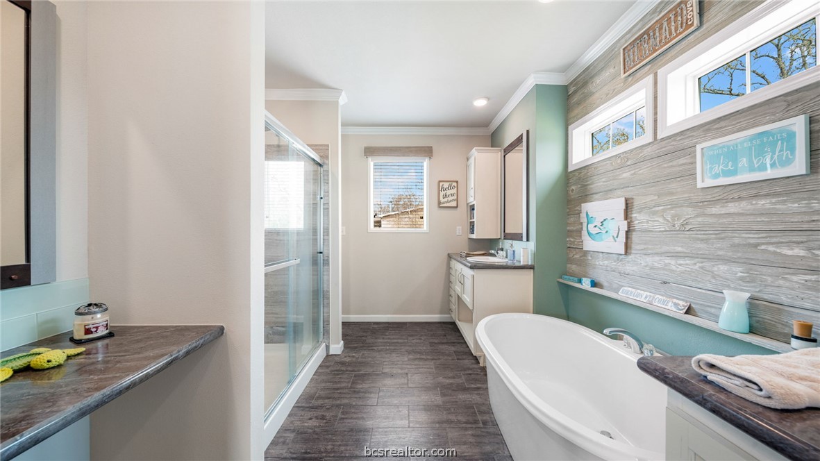 115 Cedar Lane Somerville, TX 77879 - Photo 12 of 50 a bathroom with a granite countertop sink a toilet a mirror and shower