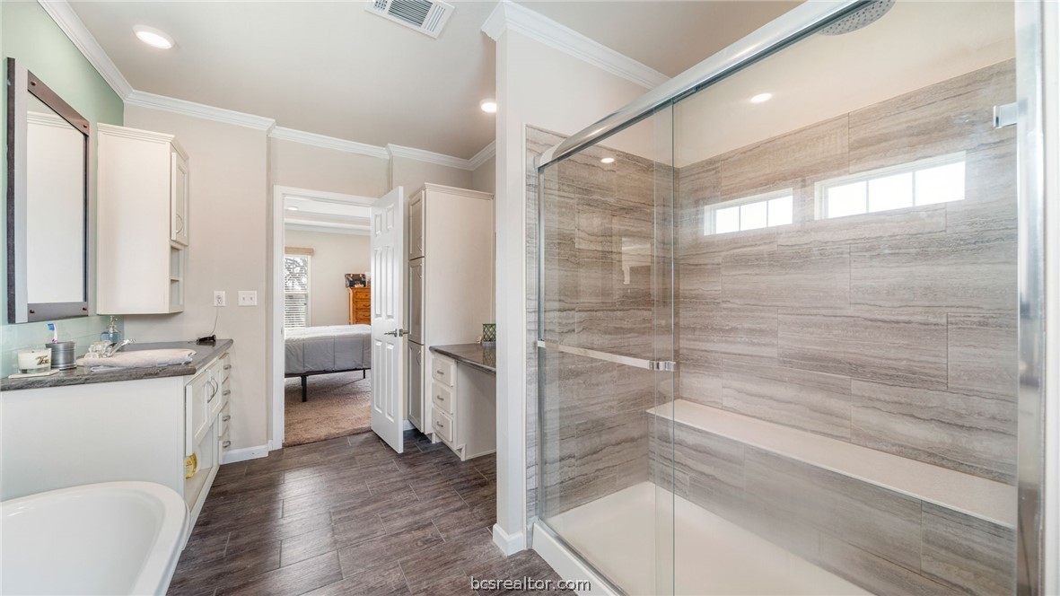 115 Cedar Lane Somerville, TX 77879 - Photo 13 of 50 a bathroom with a double vanity sink toilet and shower