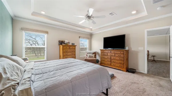 a bed room with a bed and a chandelier