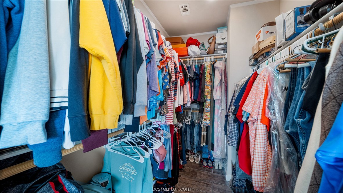 115 Cedar Lane Somerville, TX 77879 - Photo 16 of 50 a view of walk in closet with clothes and shoes