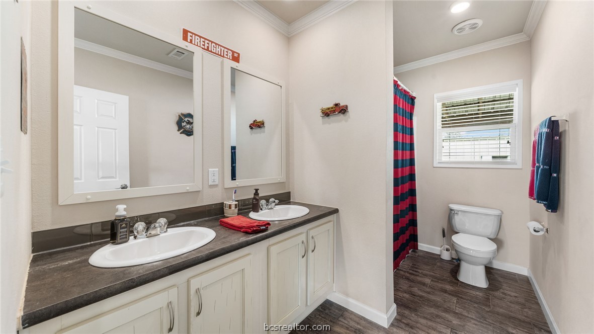 115 Cedar Lane Somerville, TX 77879 - Photo 24 of 50 a bathroom with a granite countertop sink and a mirror