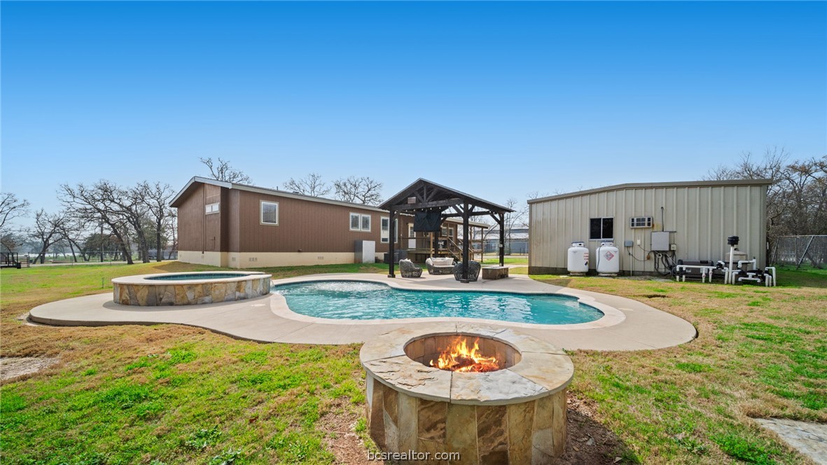 115 Cedar Lane Somerville, TX 77879 - Photo 30 of 50 a view of a house with swimming pool and a yard
