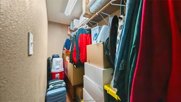 a view of a balcony with chairs and wooden floor