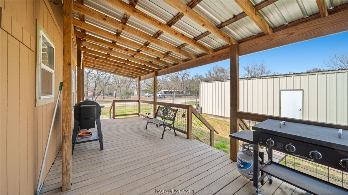 115 Cedar Lane Somerville, TX 77879 - Photo 37 of 50 a view of a balcony with chairs and wooden floor