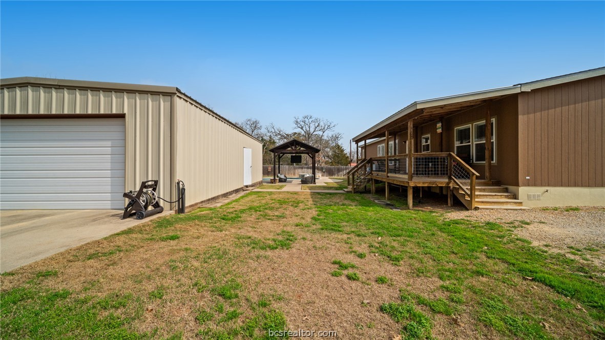 115 Cedar Lane Somerville, TX 77879 - Photo 39 of 50 a view of house with backyard and deck