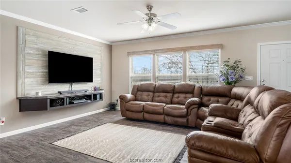 a bath room with a sink and a large mirror