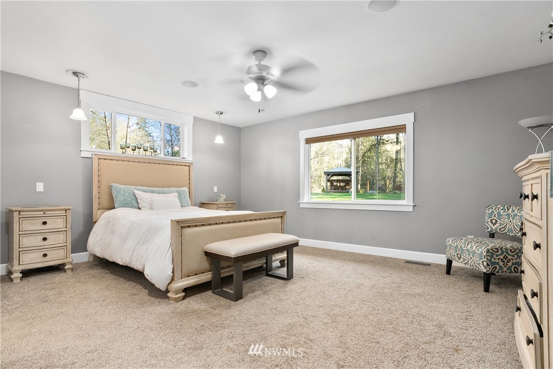 27515 Rose Road Arlington, WA 98223 - Photo 11 of 34 a bed room with a bed and a window