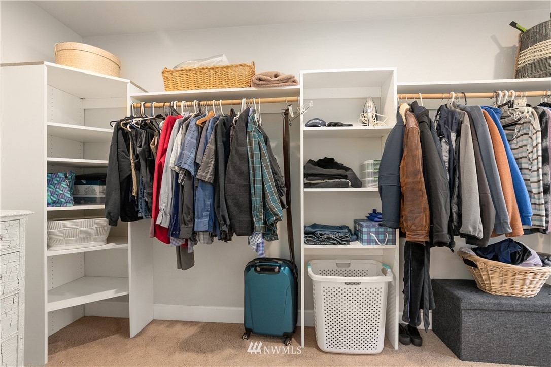 27515 Rose Road Arlington, WA 98223 - Photo 14 of 34 a view of walk in closet with clothes and shoes