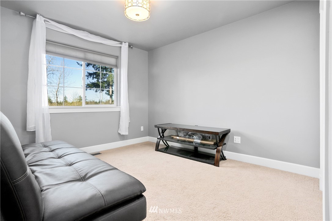 27515 Rose Road Arlington, WA 98223 - Photo 20 of 34 a bedroom with a bed and a window