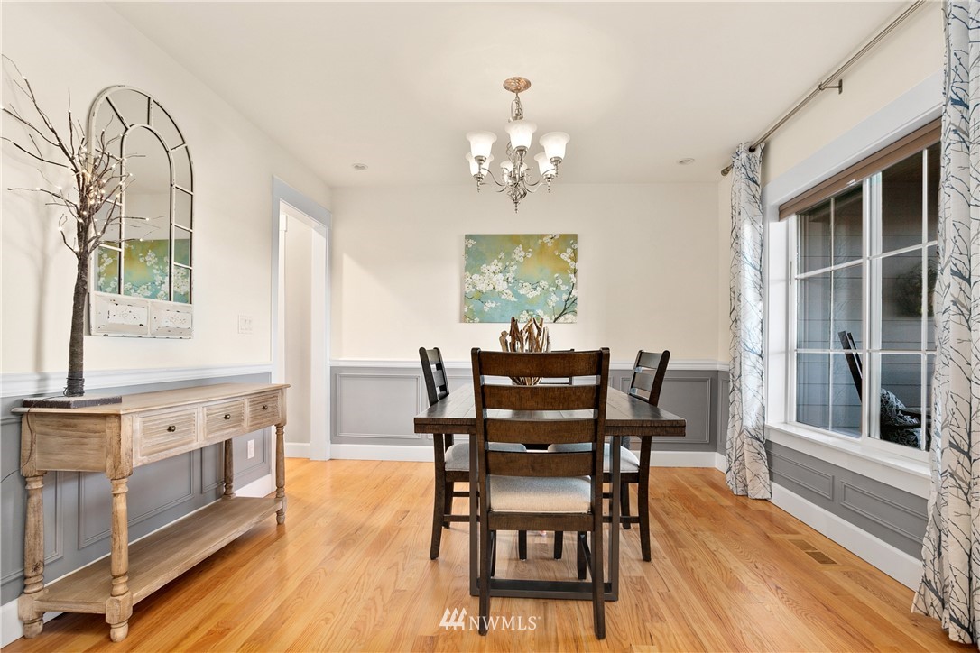 27515 Rose Road Arlington, WA 98223 - Photo 3 of 34 a view of a dining room with furniture window and wooden floor