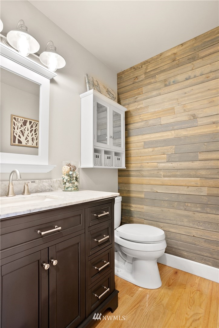 27515 Rose Road Arlington, WA 98223 - Photo 21 of 34 a bathroom with a granite countertop toilet sink and mirror