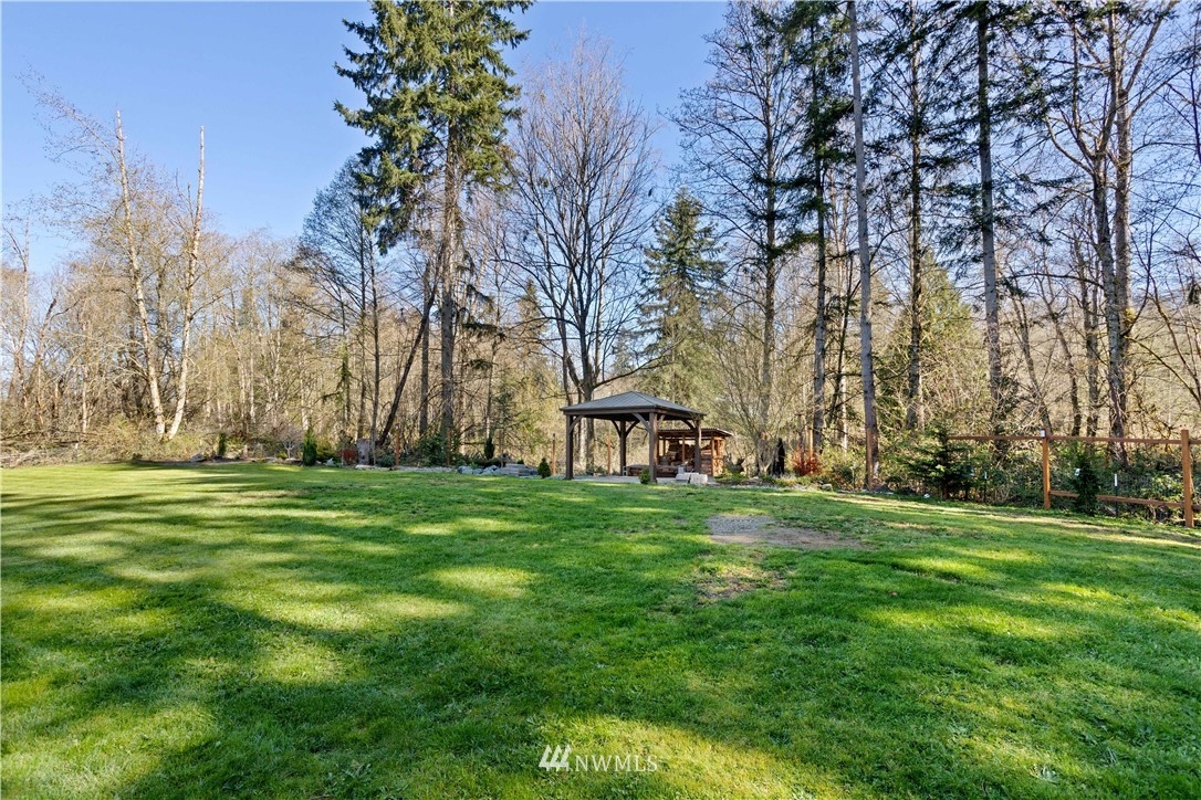 27515 Rose Road Arlington, WA 98223 - Photo 23 of 34 a big yard with lots of green space and trees