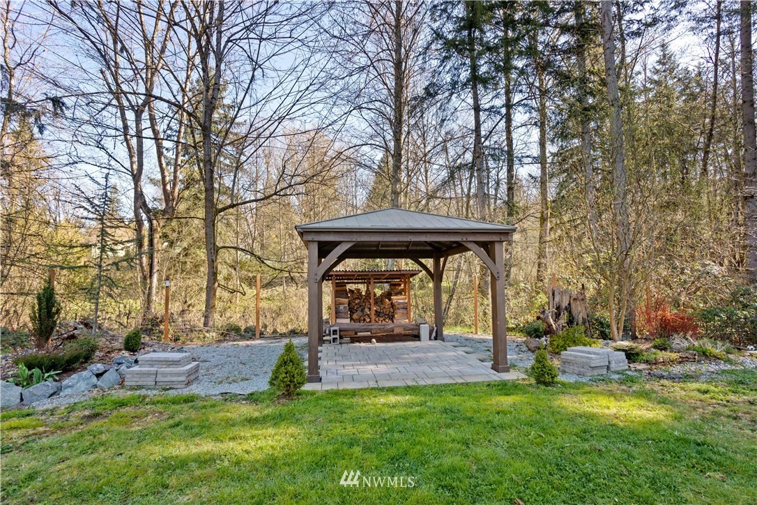 27515 Rose Road Arlington, WA 98223 - Photo 24 of 34 a view of a bench in the middle of a yard
