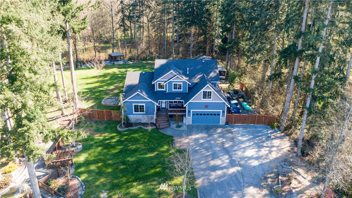 27515 Rose Road Arlington, WA 98223 - Photo 32 of 34 front view of a house with a yard