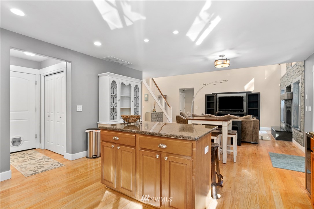 27515 Rose Road Arlington, WA 98223 - Photo 10 of 34 a view of a living room and a flat screen tv