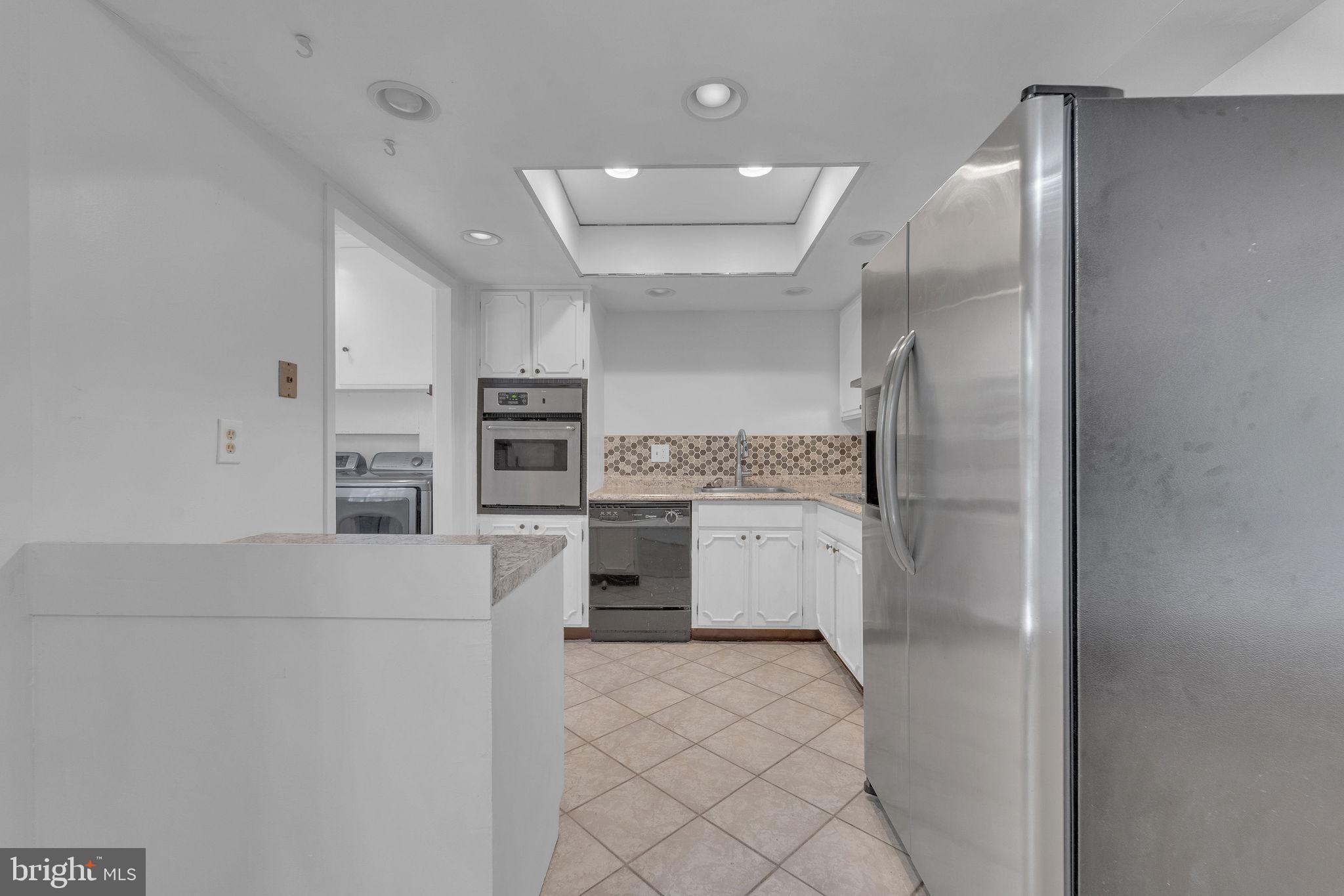 40 Rittenhouse Drive Willingboro, NJ 08046 - Photo 11 of 30 a kitchen with a refrigerator and microwave
