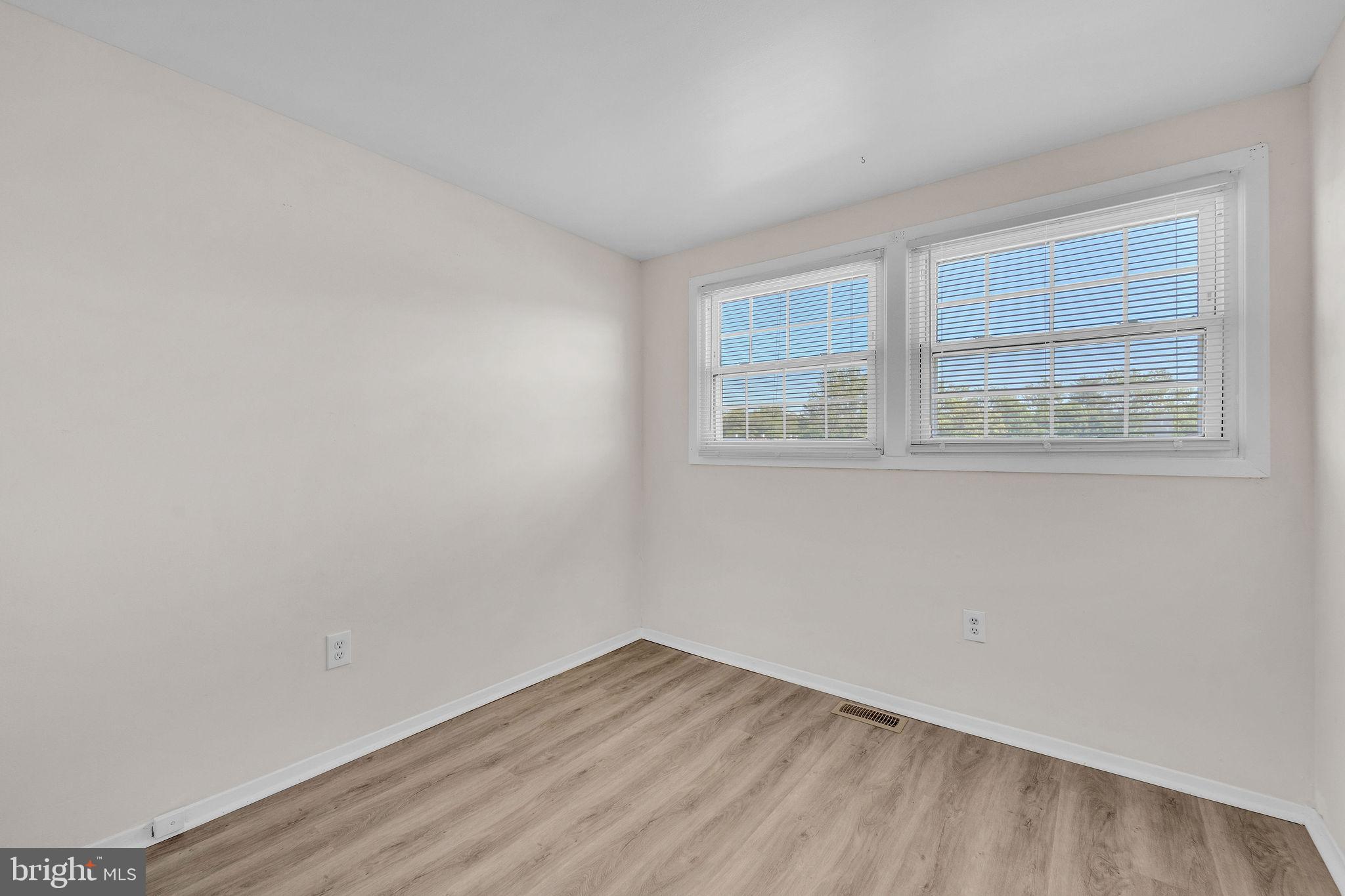 40 Rittenhouse Drive Willingboro, NJ 08046 - Photo 19 of 30 a view of an empty room with wooden floor and a window
