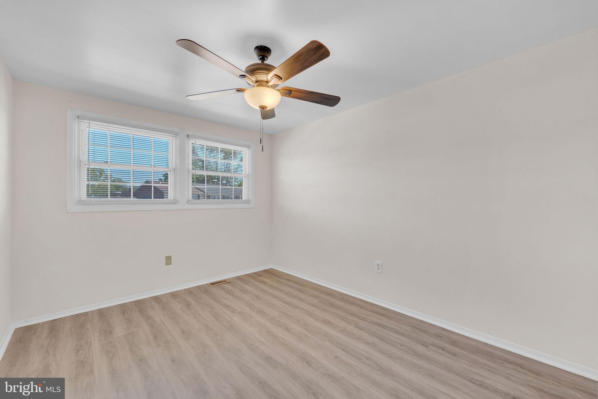 40 Rittenhouse Drive Willingboro, NJ 08046 - Photo 21 of 30 an empty room with wooden floor fan and windows