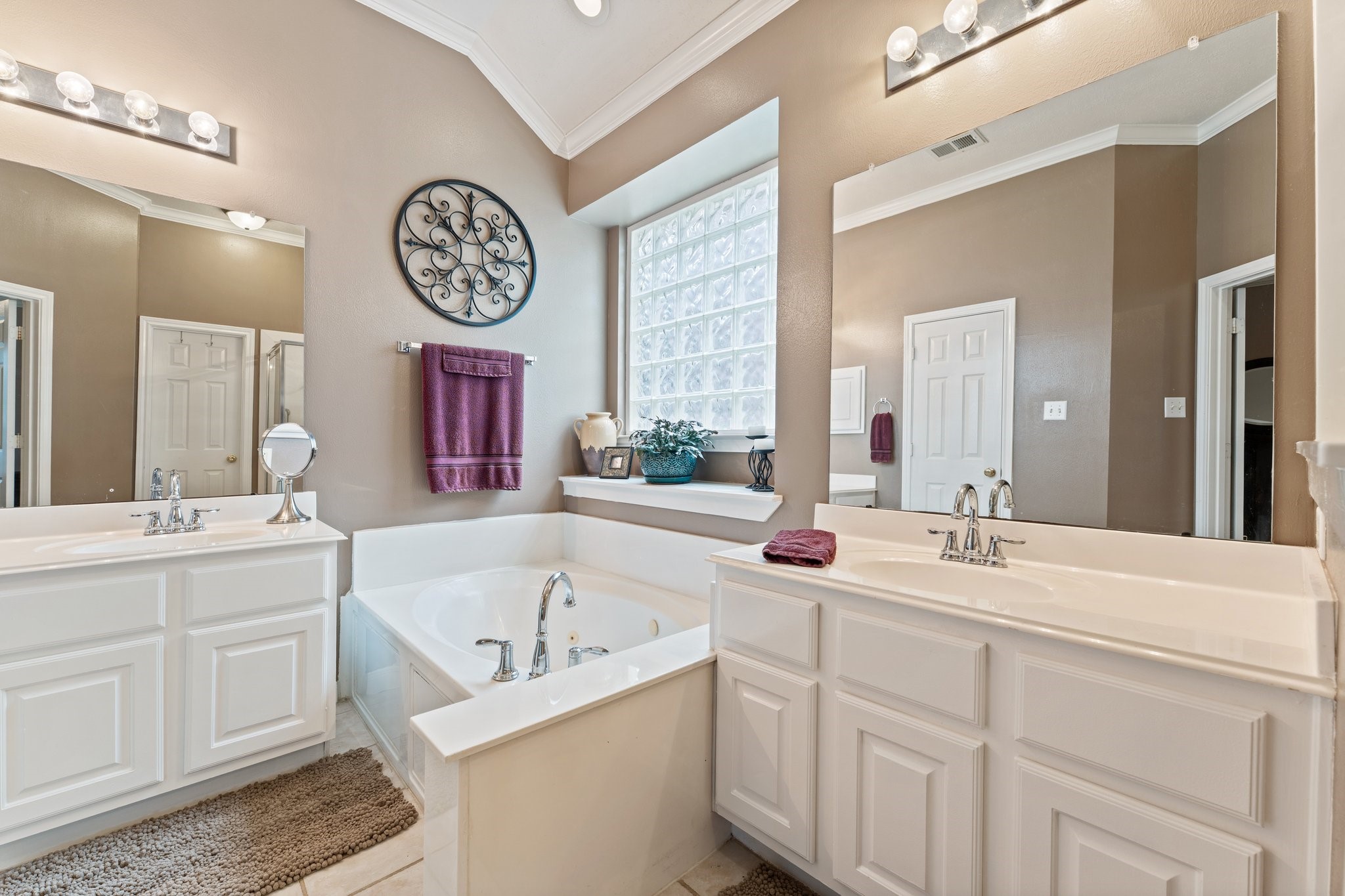 25447 China Springs Spring, TX 77373 - Photo 22 of 45 Primary bathroom offers the perfect blend of function and relaxation, complete with double vanities and a jetted tub ideal for unwinding.