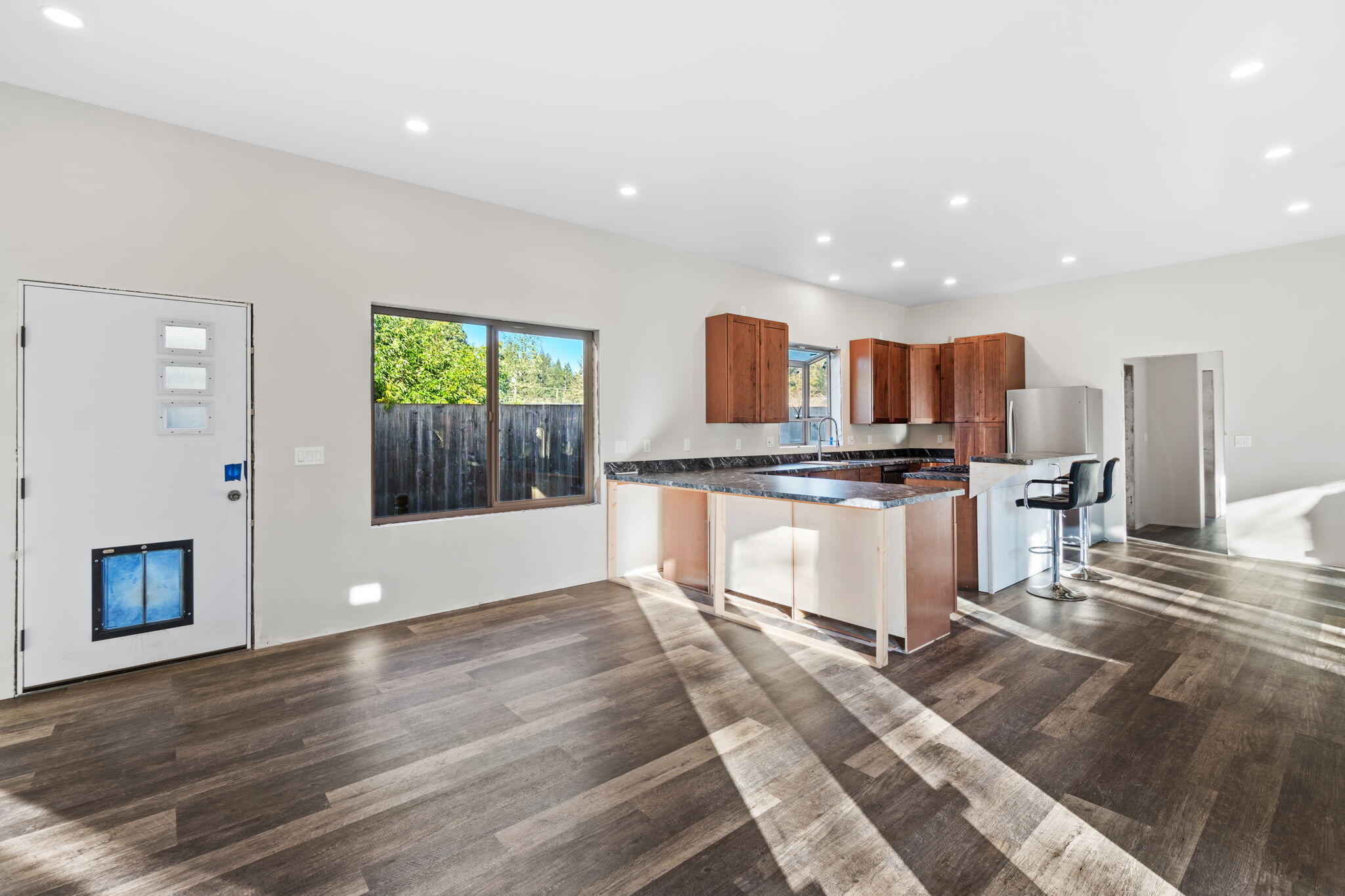 61 Kingston Road Fieldbrook, CA 95519 - Photo 7 of 48 a kitchen with stainless steel appliances kitchen island granite countertop a stove a sink and a microwave