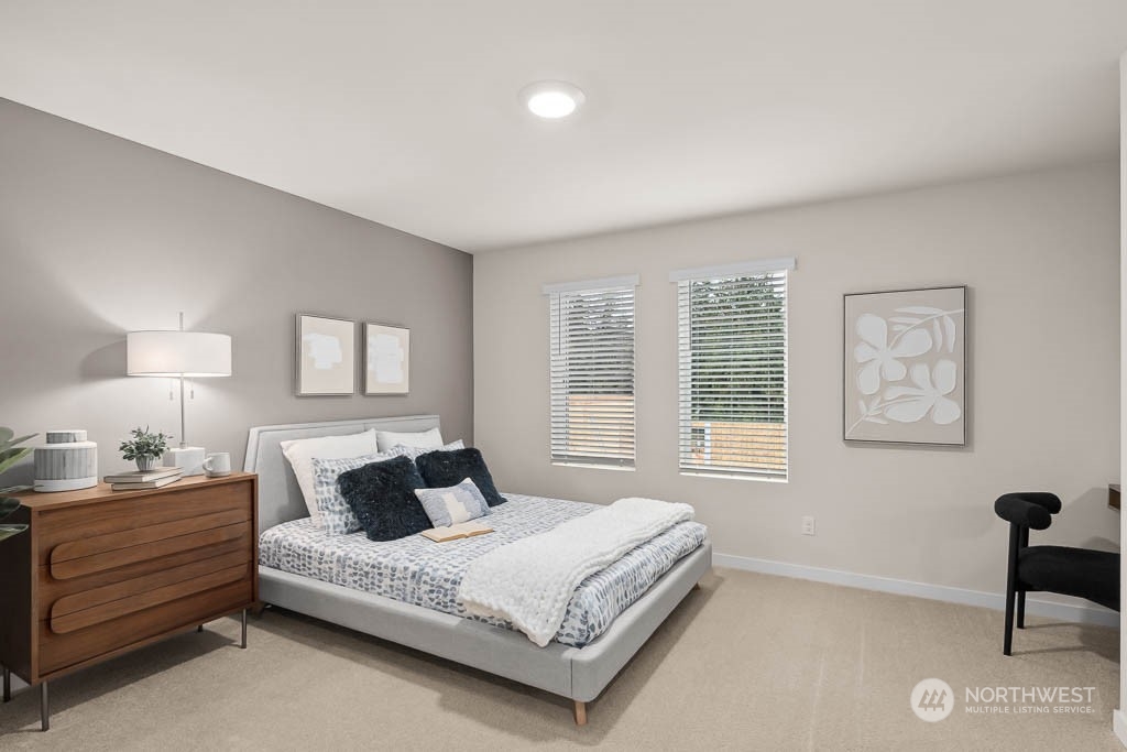 19524 16th Avenue Southeast, Unit B5 Bothell, WA 98012 - Photo 11 of 20 a bedroom with a bed and a lamp next to a window