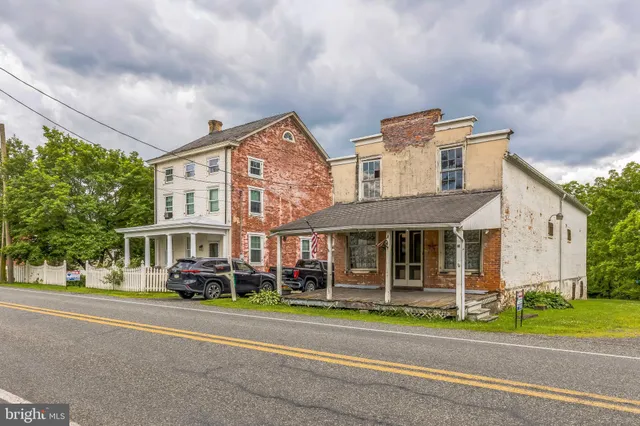 a front view of a building with garden