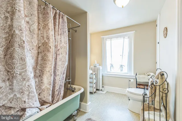 a view of a house with a barbeque and wooden floor