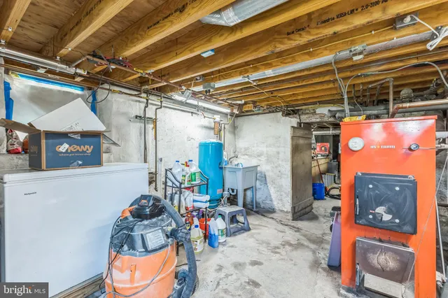 a view of a backyard with a garden and entertaining space