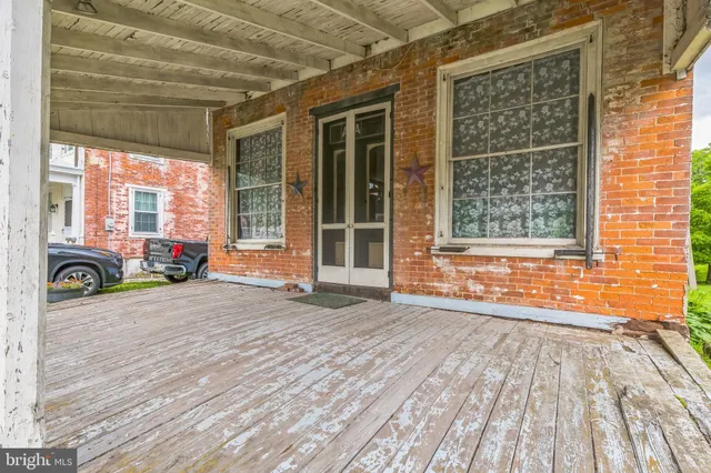 a view of a back yard of the house and plants