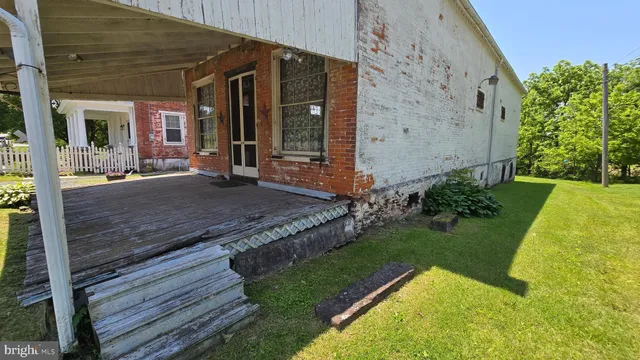 a view of outdoor space with wooden floor and barbeque oven