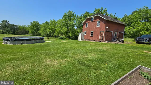 a big yard with lots of green space and trees