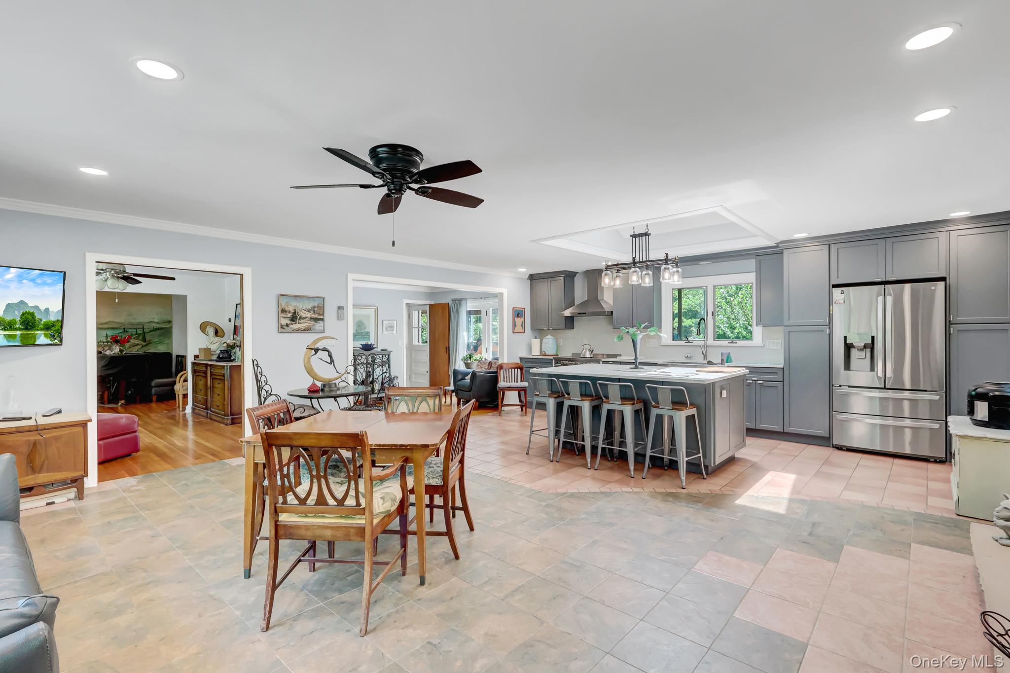 100 Elwood Road Northport, NY 11768 - Photo 5 of 39 Spacious open-concept living area featuring large format tile flooring and recessed lighting