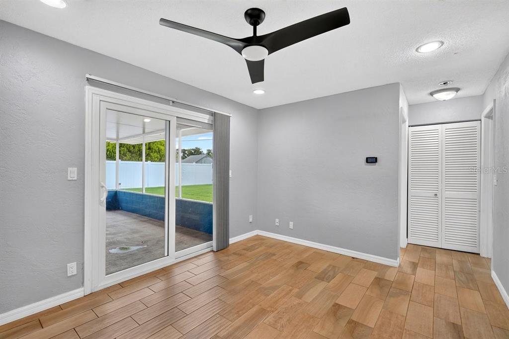 1309 Suwanee Road Daytona Beach, FL 32114 - Photo 12 of 33 a view of an empty room with glass door
