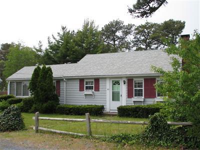 29 Bain Road Dennis Port, MA 02639 - Photo 1 of 21 a front view of a house with a yard