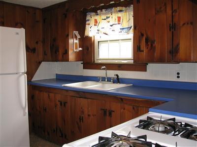 29 Bain Road Dennis Port, MA 02639 - Photo 13 of 21 a kitchen with a sink a stove and a refrigerator